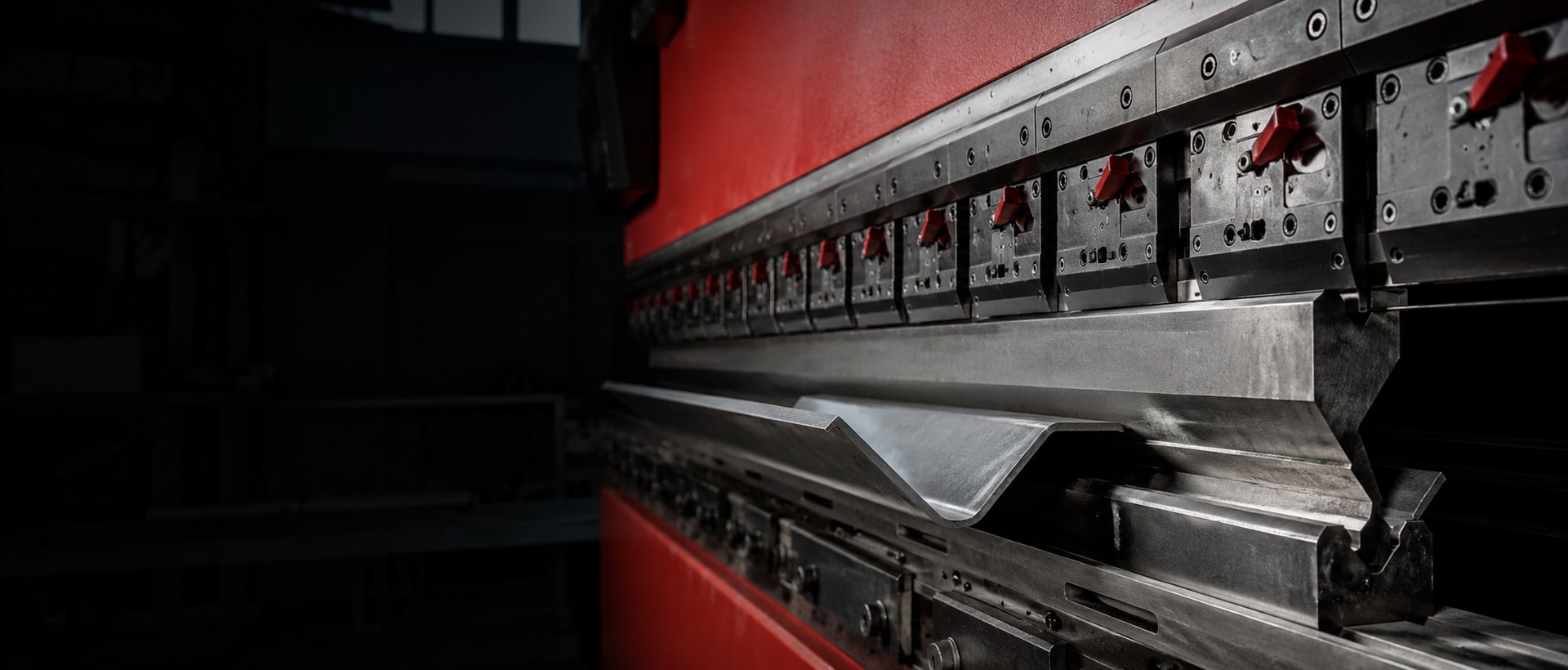 Press brake punch and segmented die tooling forming sheet metal