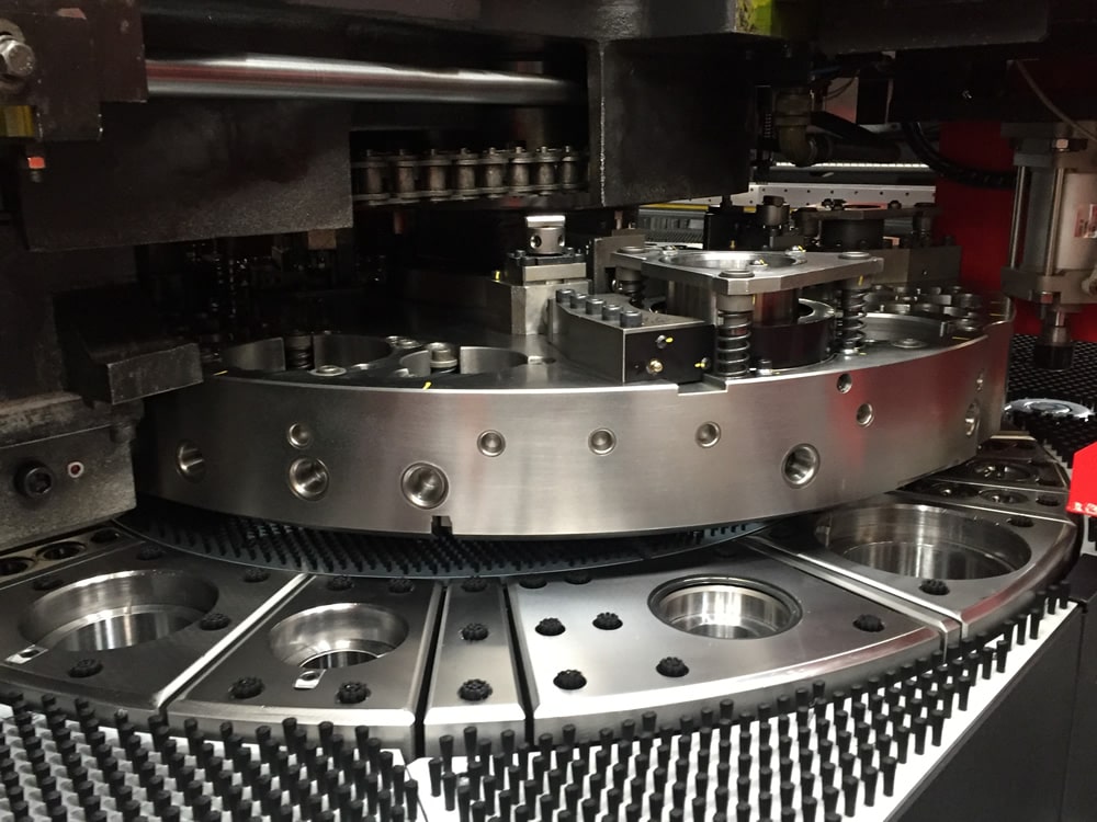 Amada EMZ 3510 turret punch — tool stations loaded with punches and dies